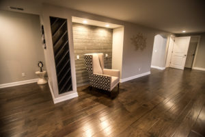 shiplap niche for basement office with dark wood flooring