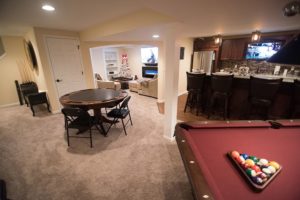 basement with pool table and poker table carpet