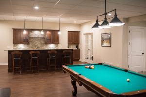 pool table in basement with classic finishes