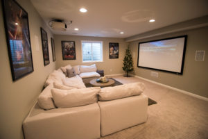 bright light grey basement with carpet and large sectional in Brighton, MI