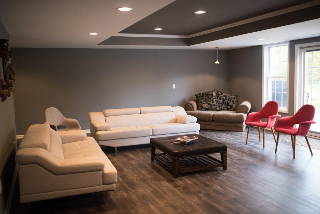 finished basement living room with seating