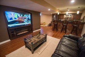 Living room in basement with vinyl plank flooring in Canton, Michigan