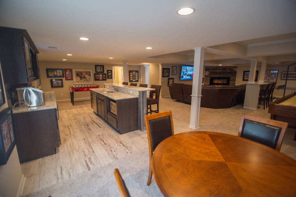 finished basement with post wraps and bar area