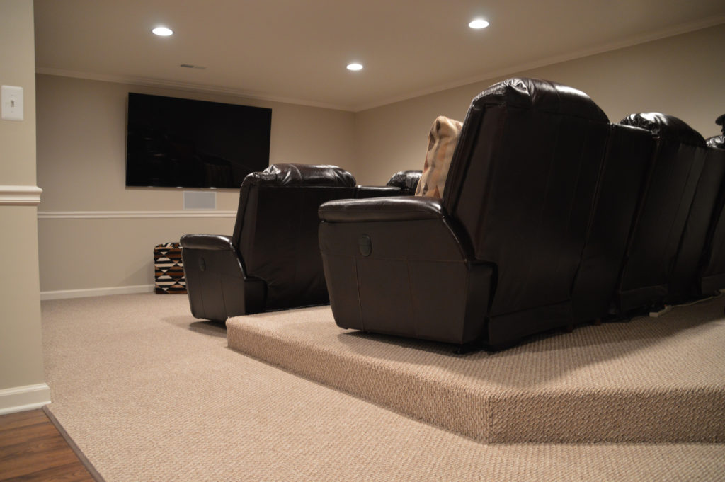 basement theater with platform seating for a good view