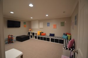 basement playroom for the kids with carpet