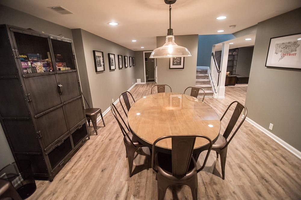 Remodeled basement with open floorplan and industrial design in Franklin, Michigan