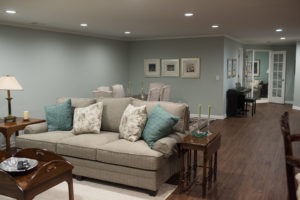 living room and formal dining area in basement