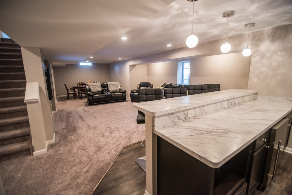 bar area overlooking living room basement