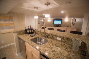 finished basement kitchen with granite countertops