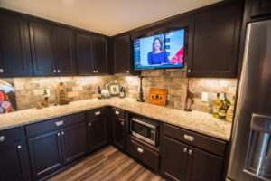 custom bar in finished basement novi dark vinyl plank granite countertops