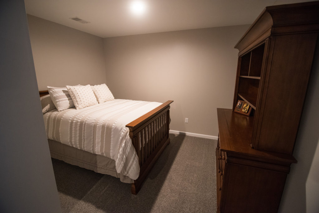 basement with second bed and closet with carpet