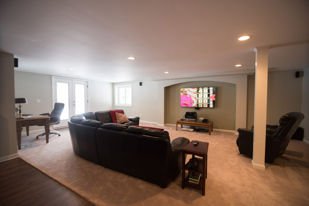 spacious living room with carpet in lower level