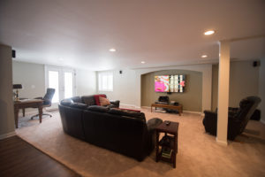 spacious living room with carpet in lower level