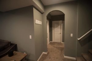 Archway design feature in basement hallway in Royal Oak, Michigan