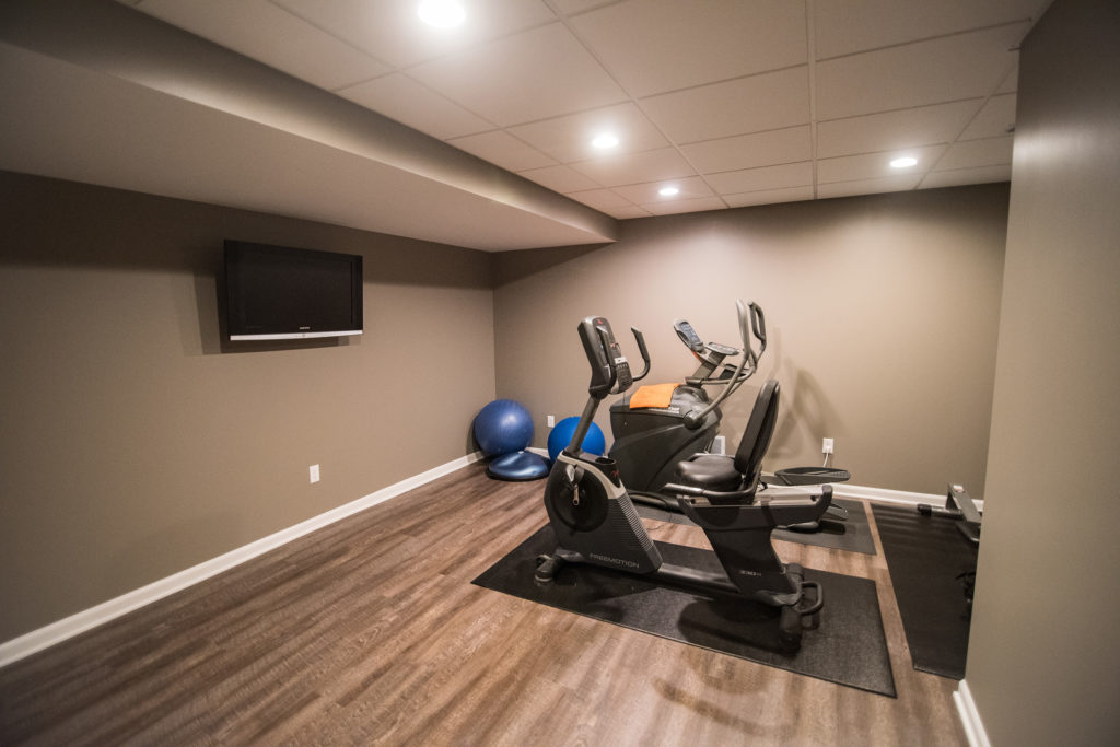 basement fitness room ad vinyl plank flooring