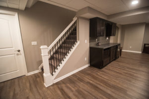 detailed staircase spindles with white railing in basement