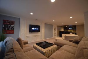 Troy Michigan living room in basement with detailed media center design