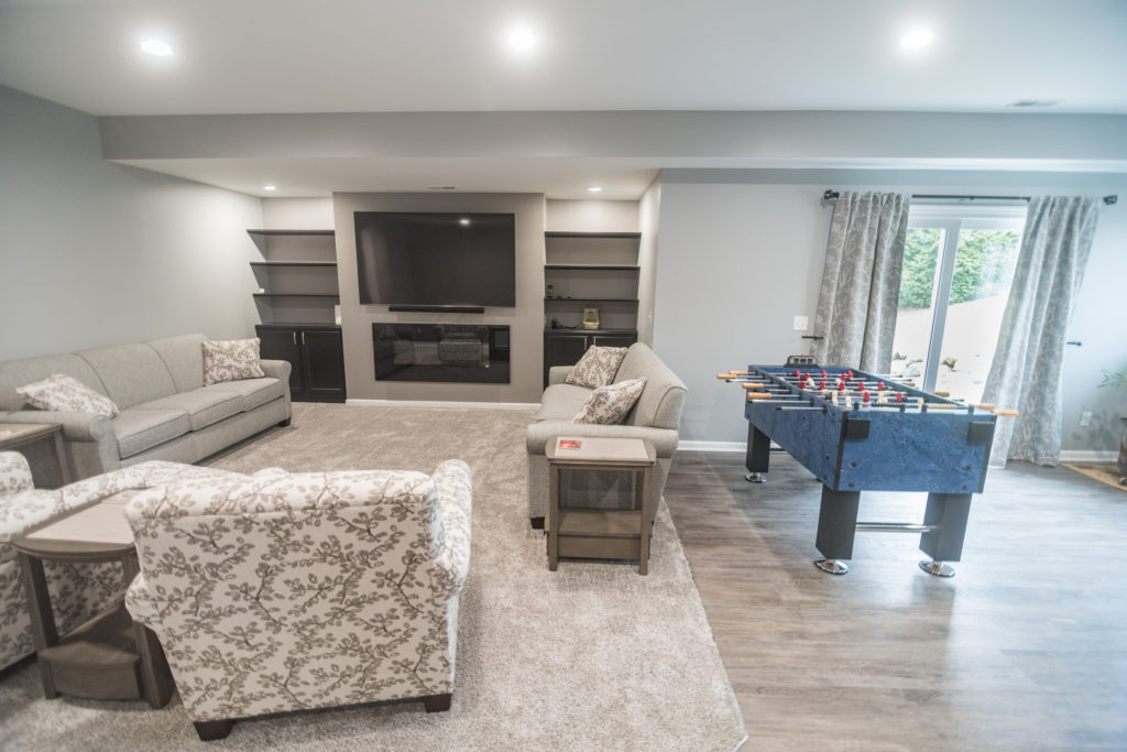 finished basement with carpeting and built in storage and carpeting