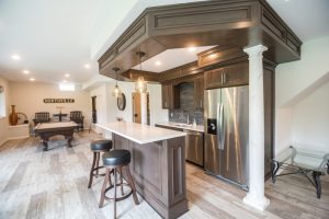 custom bar with dark stain and white posts