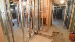 framed in basement with steel studs and plumbing with concrete breakup