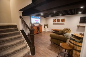 open rail staircase with dark stained handrail
