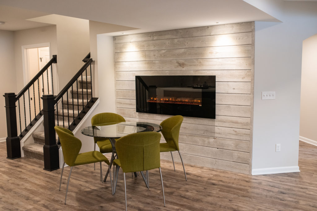 electric fireplace on ship lap wood wall