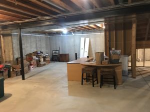 Unfinished basement walls provide a plan