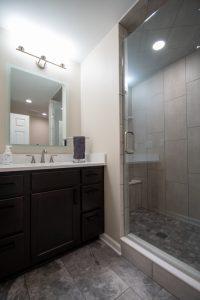 Adding a bathroom on your lower level can be super convenient when having guests stay over.