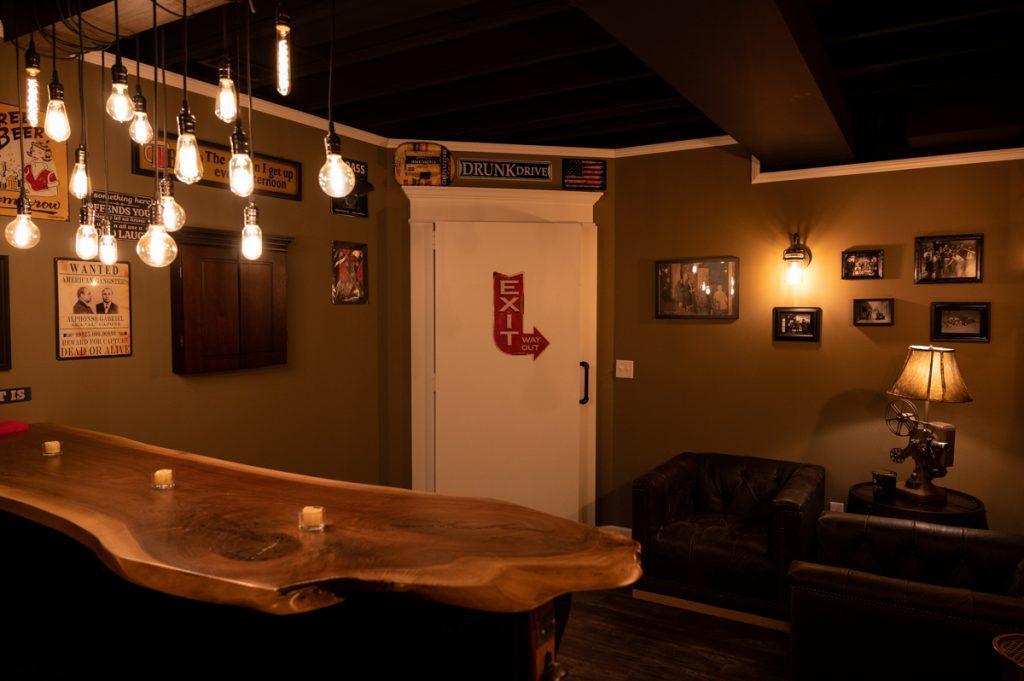 View from behind the bar in the speakeasy secret room looking towards the exit door.