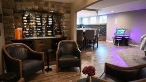 WIne nook area looking out towards the main bar with the view of the stone wine rack wall.