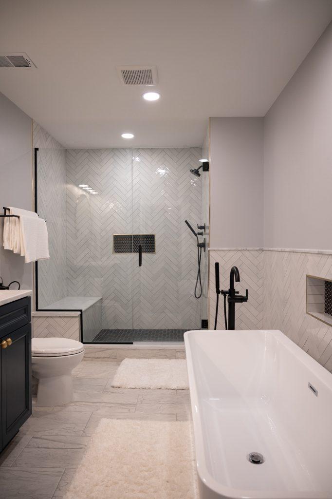 Finished basement bathroom with walk-in shower and tub in Bloomfield Hills, Michigan