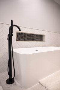 Finished basement bathroom with niche tile and large bathtub in Bloomfield Hills, Michigan