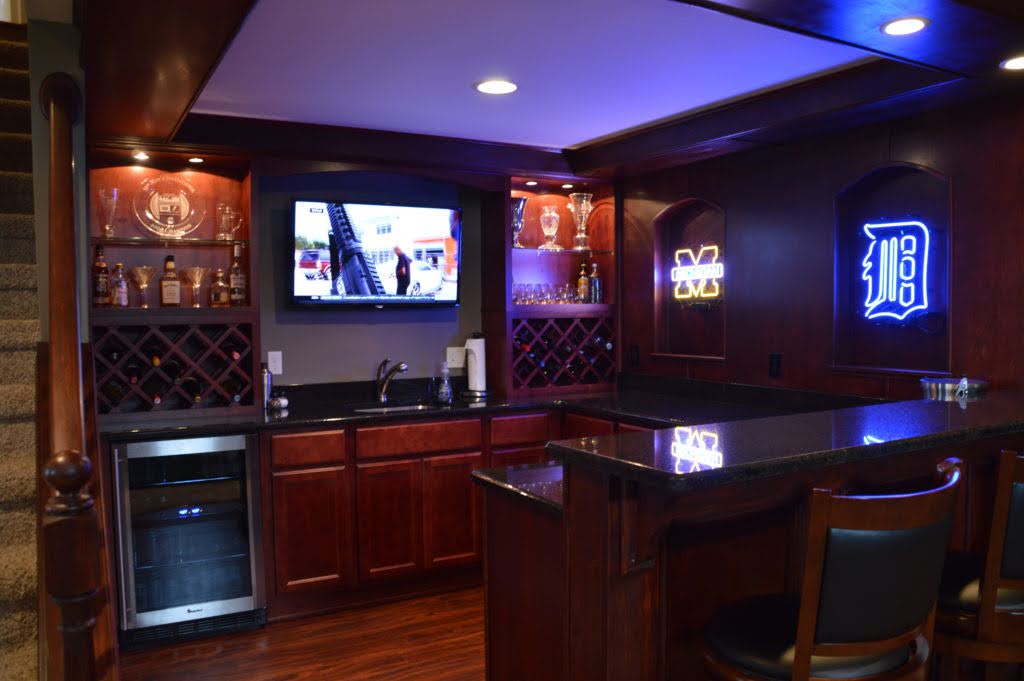 Home bar setup in a remodeled basement man cave