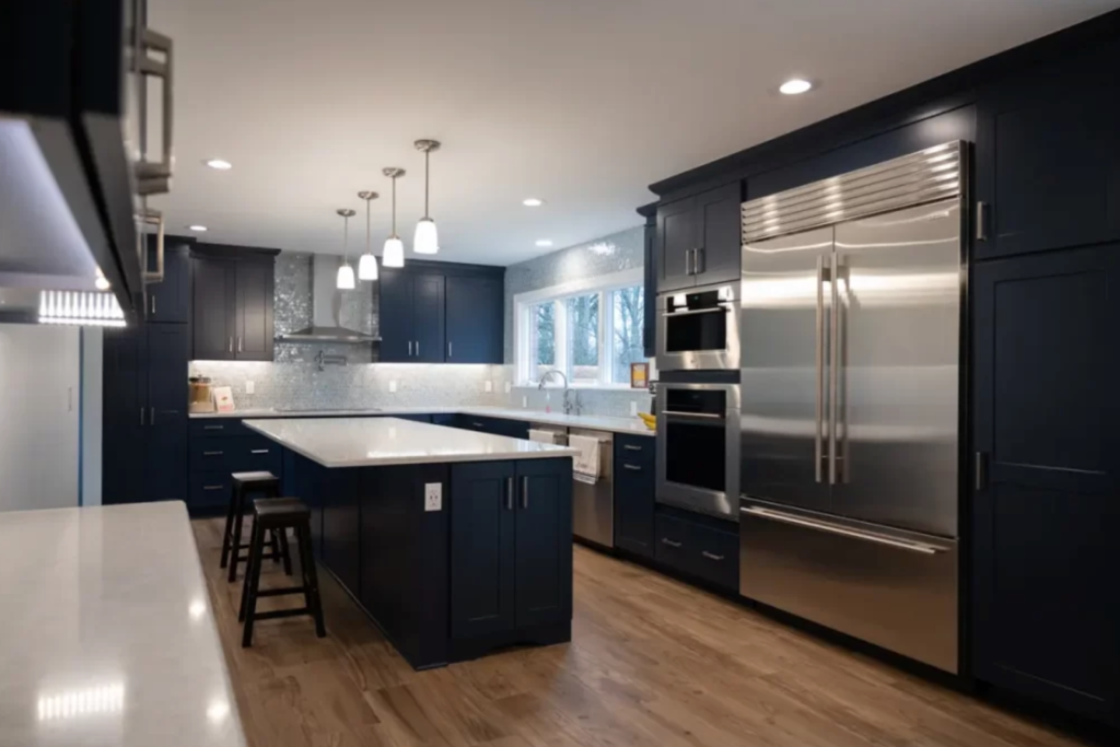Modern 10x10 kitchen remodel featuring black cabinetry, stainless steel appliances, and a central island.