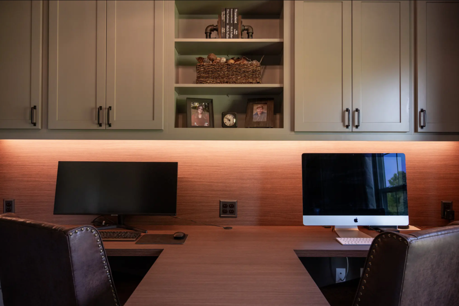 Elegant home office with dual monitors and custom cabinetry highlighting quality remodeling work