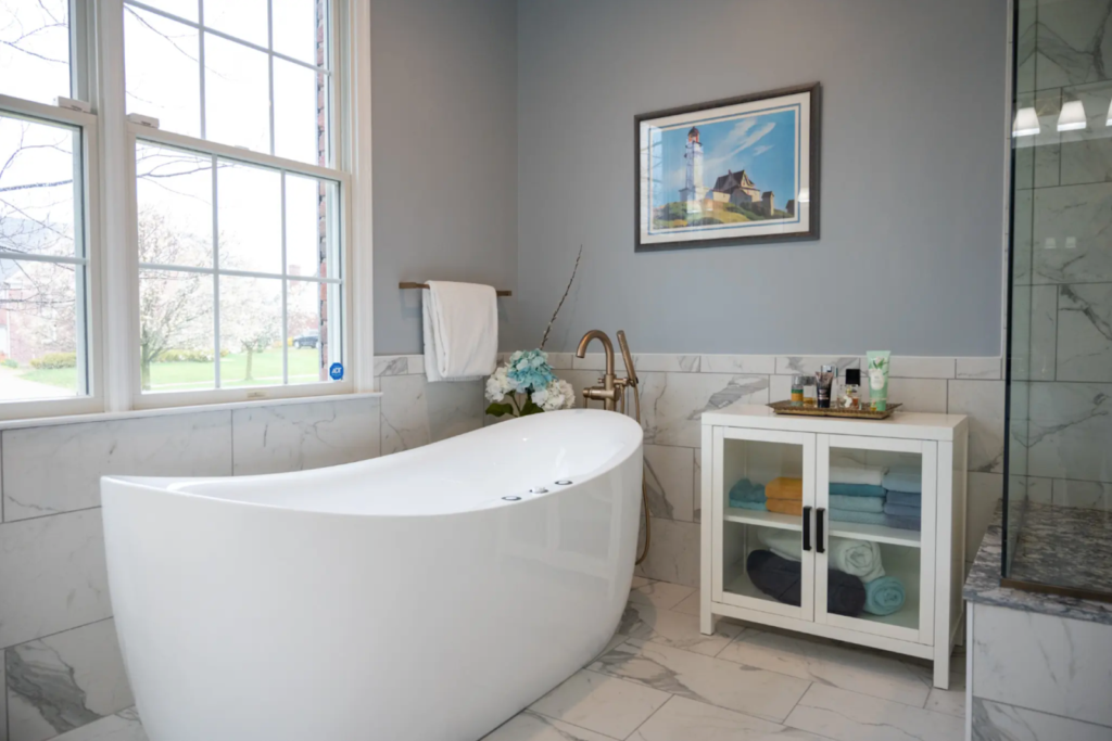 Modern bathroom remodel with large window and clean design from professional contractor